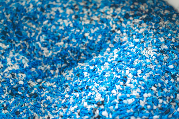 plastic regrind pieces in a pile