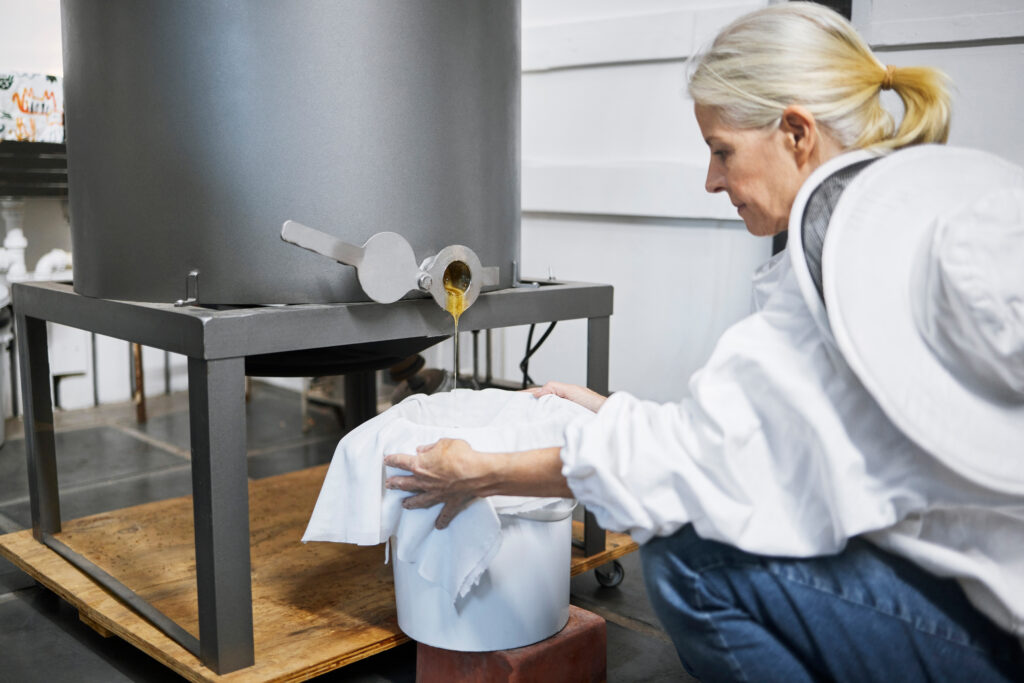 beekeeper woman honey production and machine in f 2025 04 06 07 50 52 utc