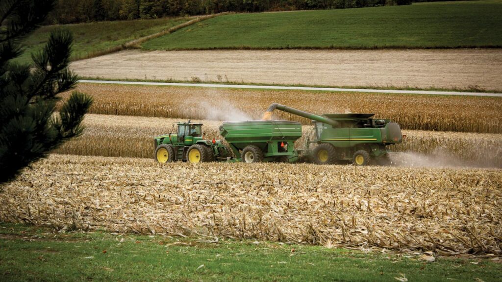 a tractor harvests a field